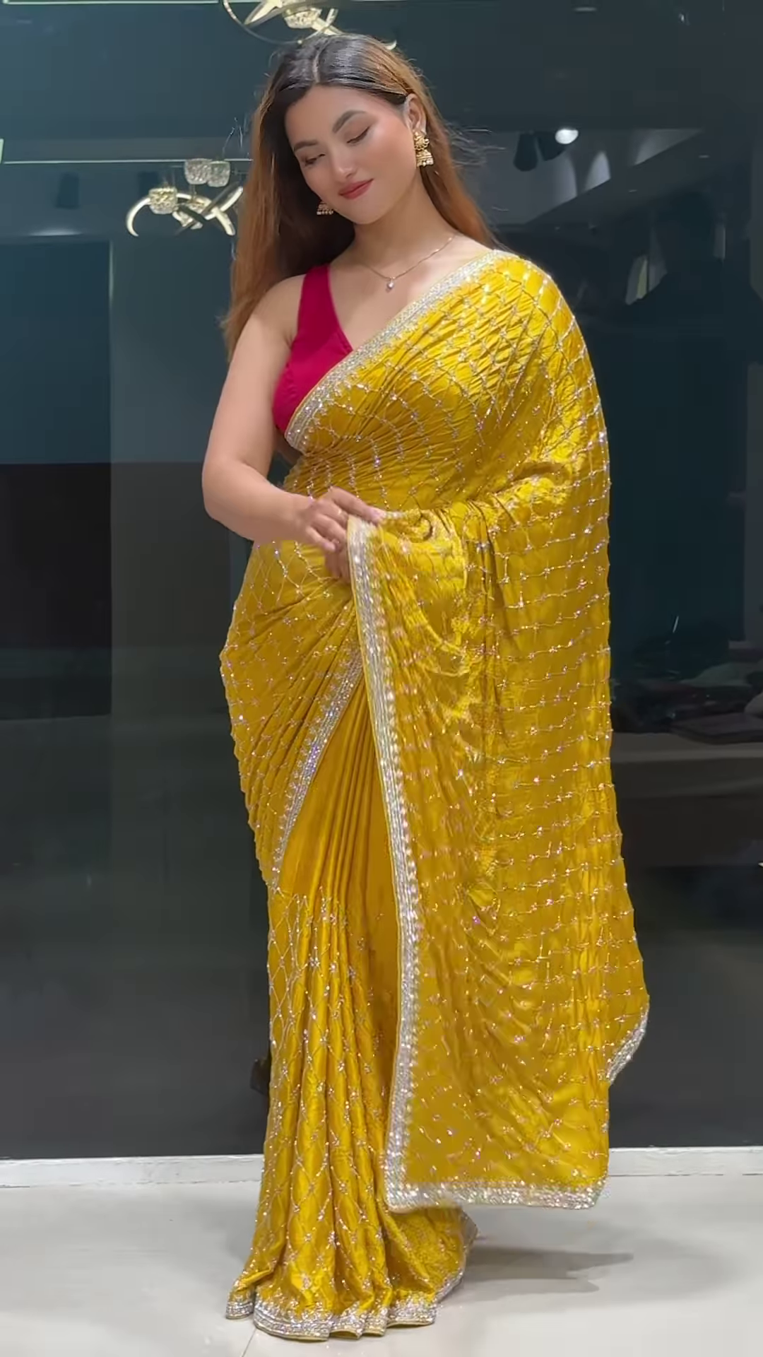Radiant Yellow Georgette Saree with All-Over Sequin Lattice Pattern and Ornate Silver Zari Border